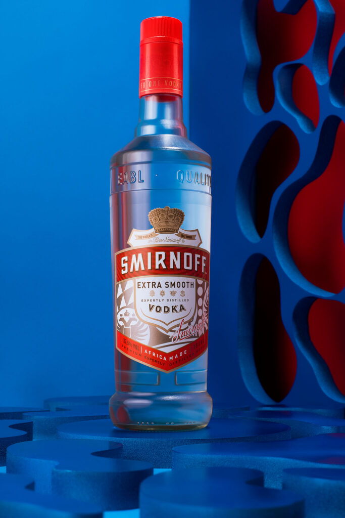 Smirnoff extra smooth shot on blue and red background